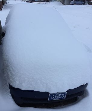 A snow-covered vehicle